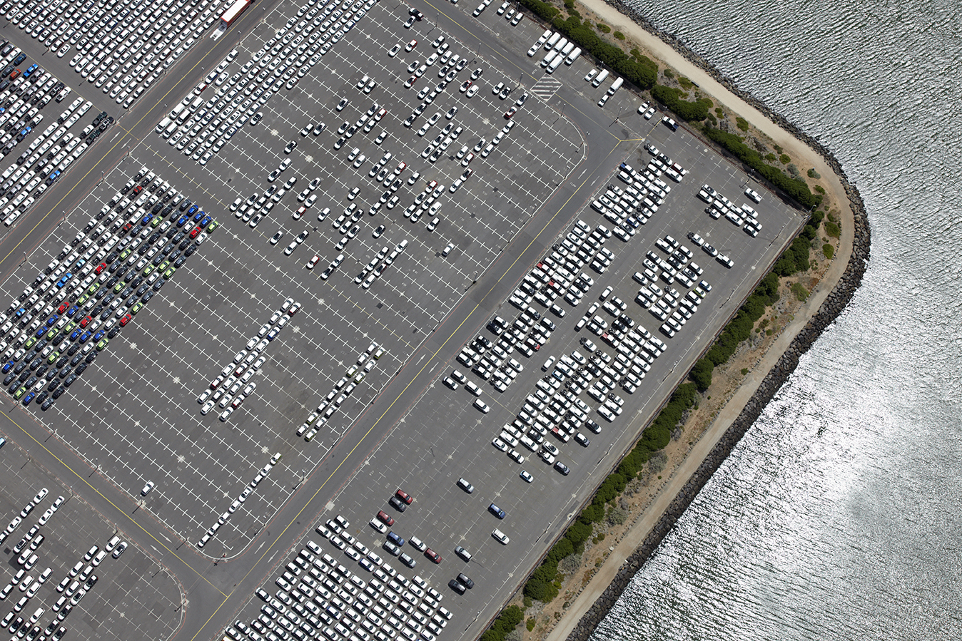 aerial view of a parking lot with many cars
