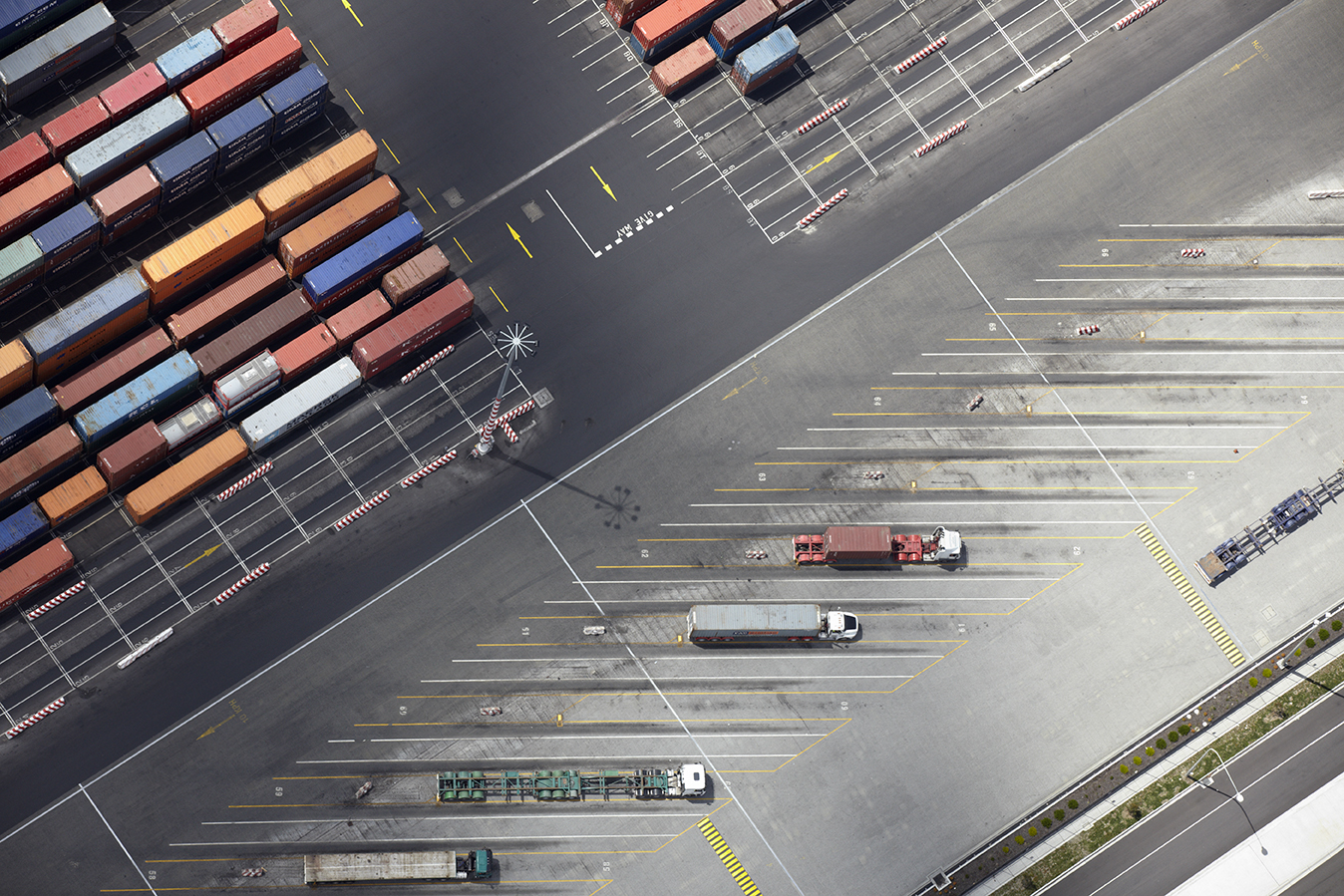 a aerial view of a parking lot with containers