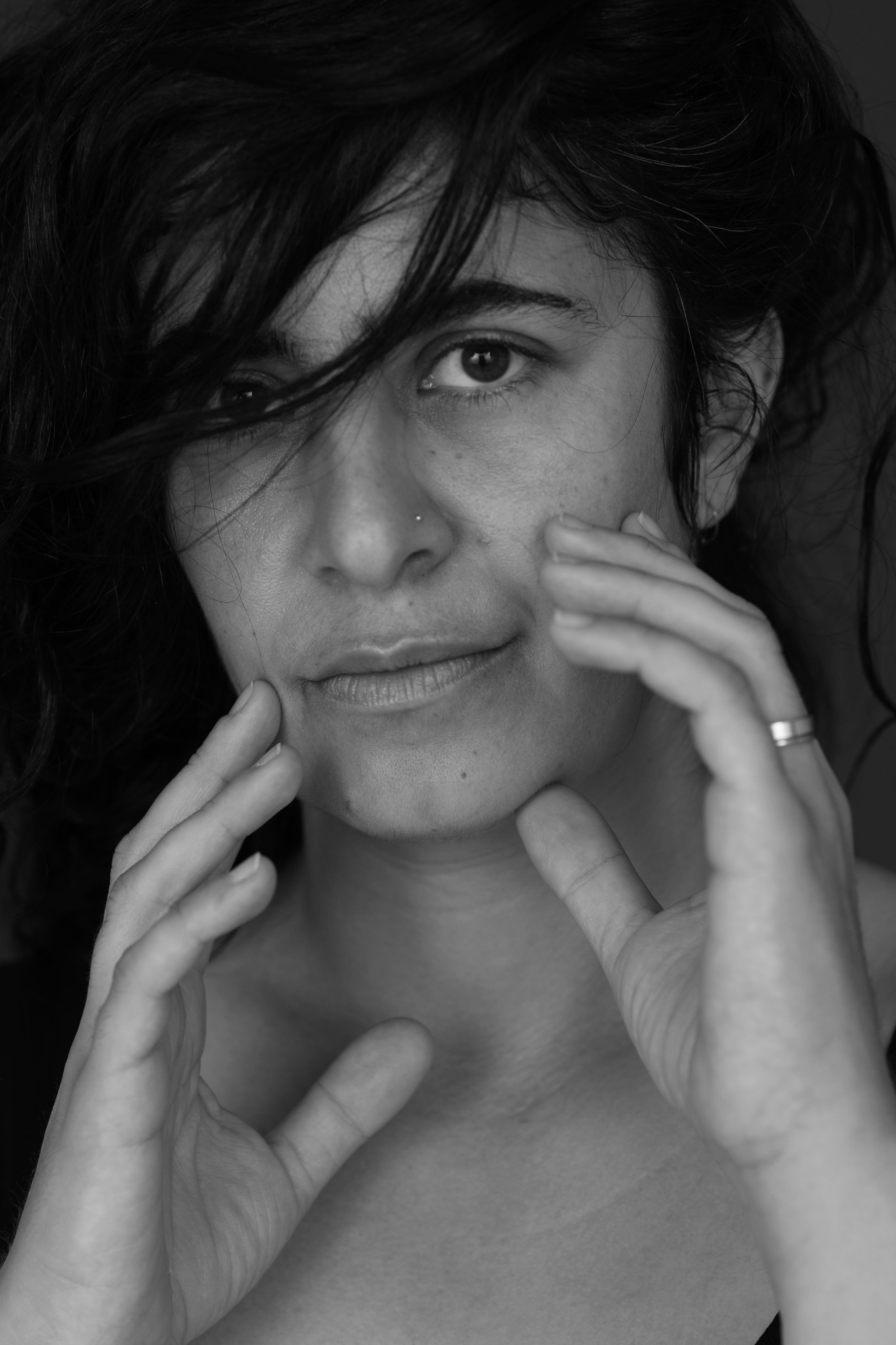 a woman with her hands on her face