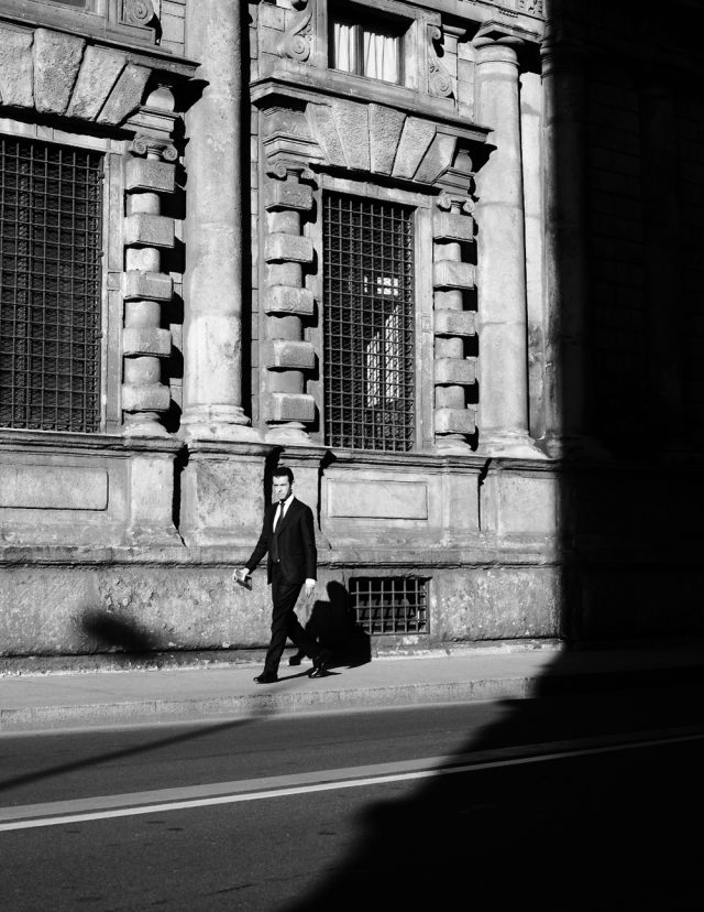 a man walking on the sidewalk