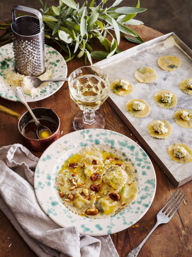 food on a plate next to a tray of food