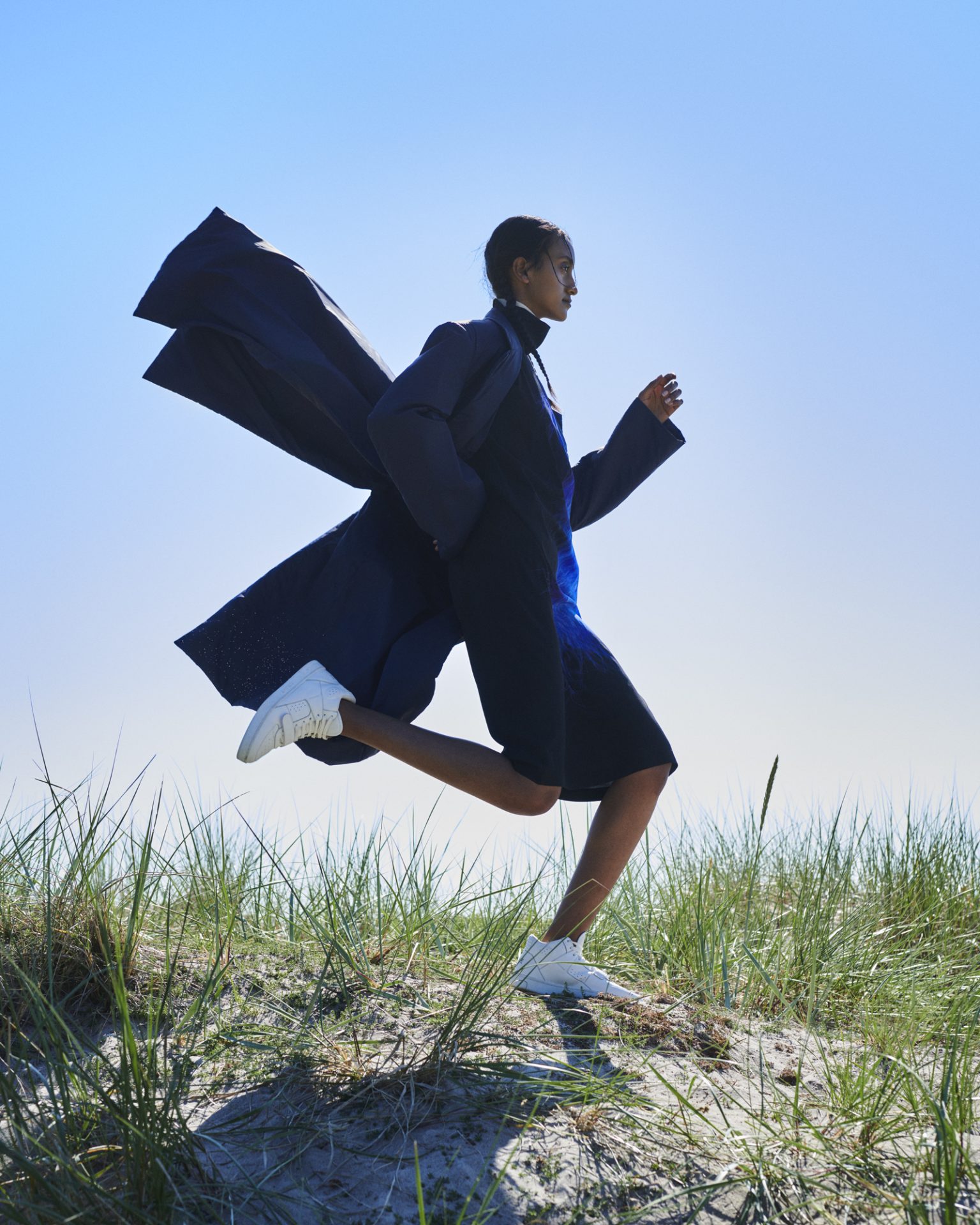 a woman running in a field