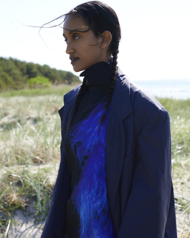 a woman in a blue jacket