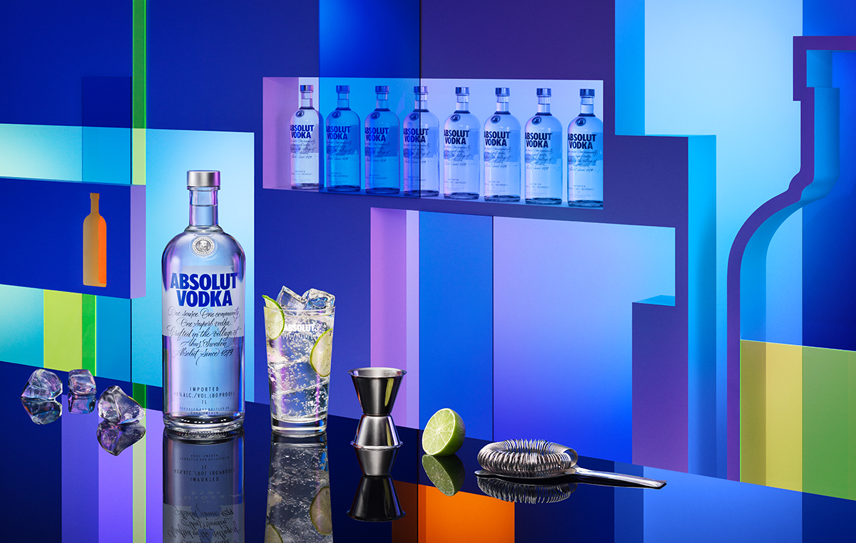 a bottle of vodka next to a glass of liquid