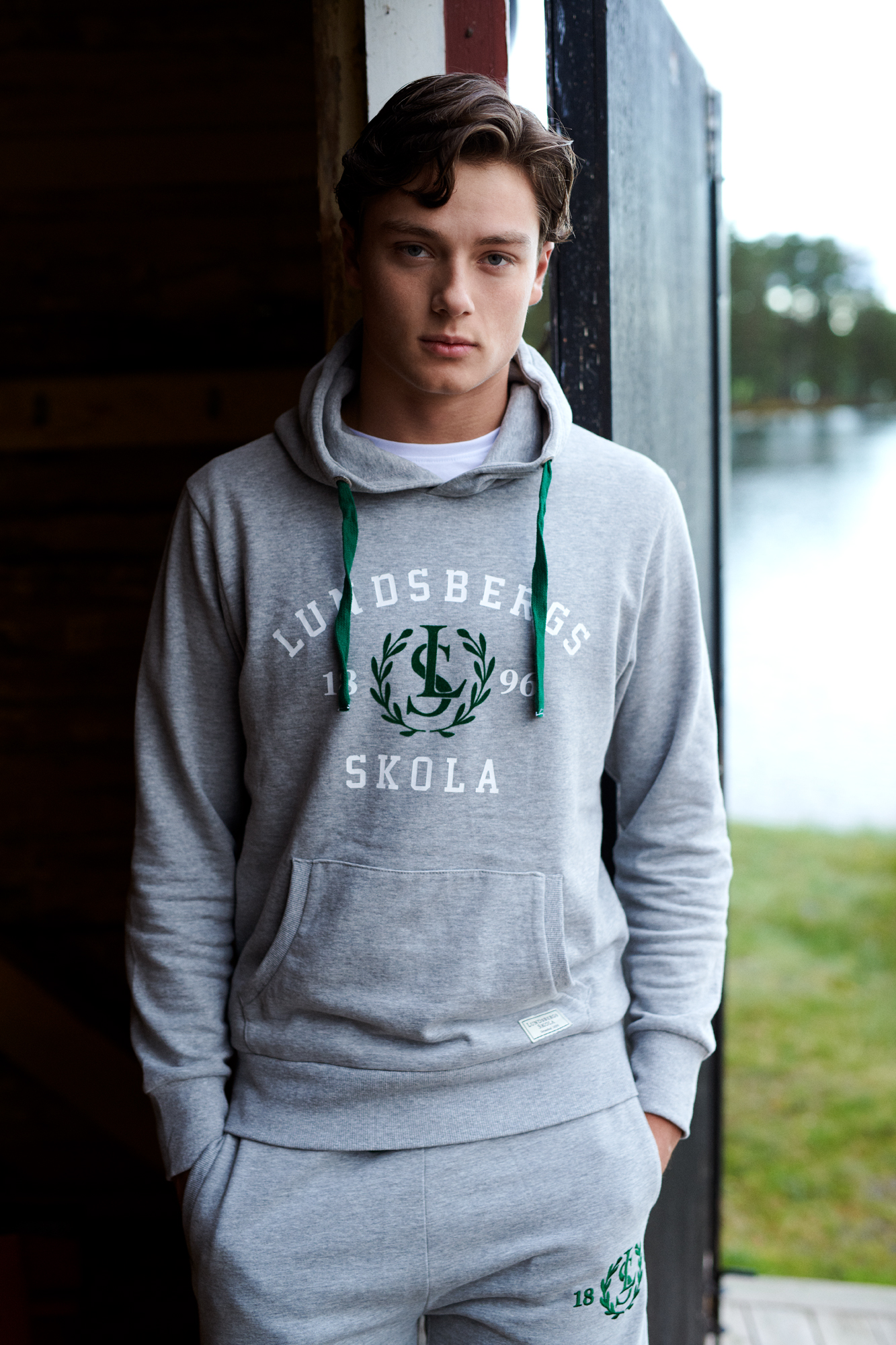 a man standing in front of a window