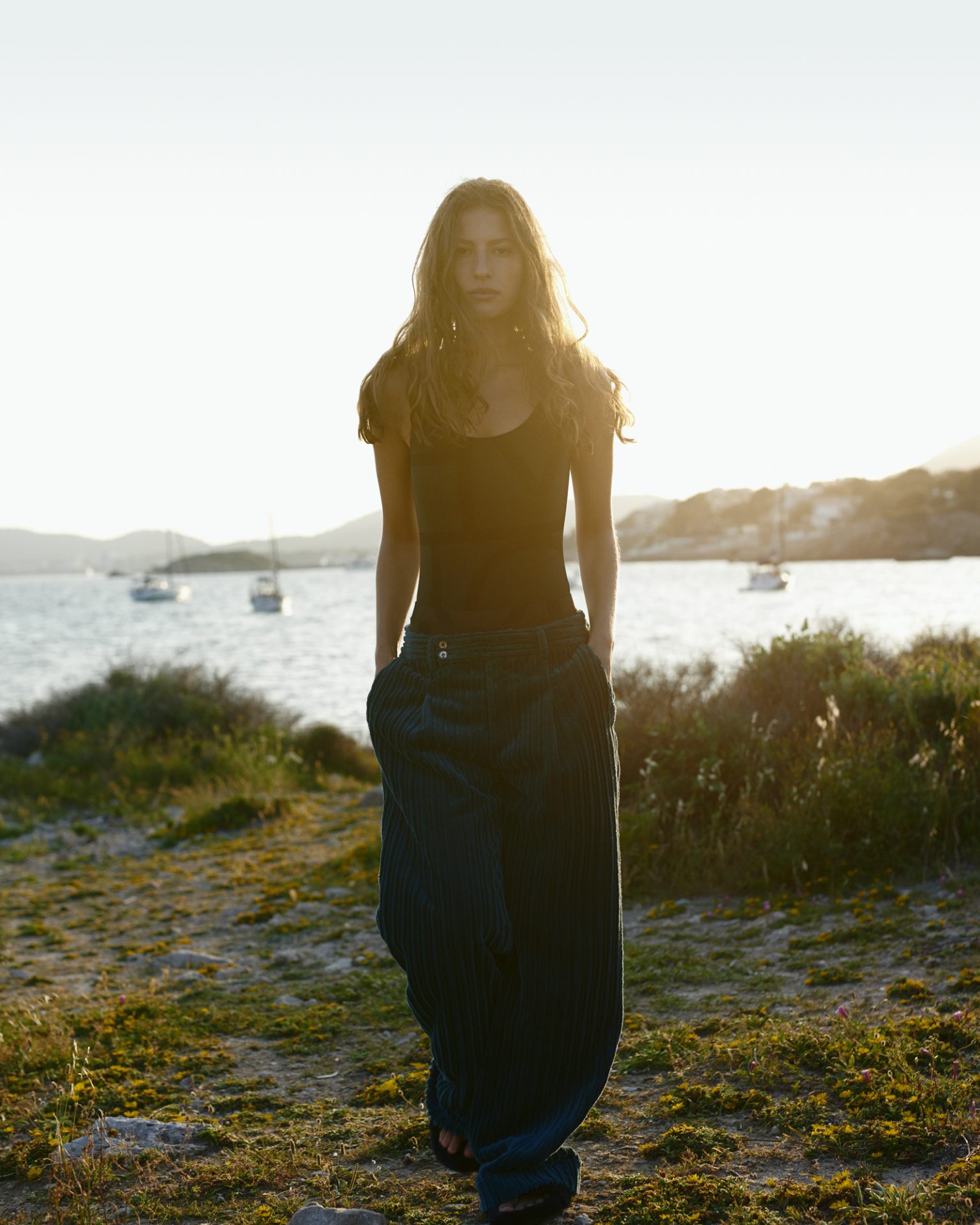 a woman standing on a beach