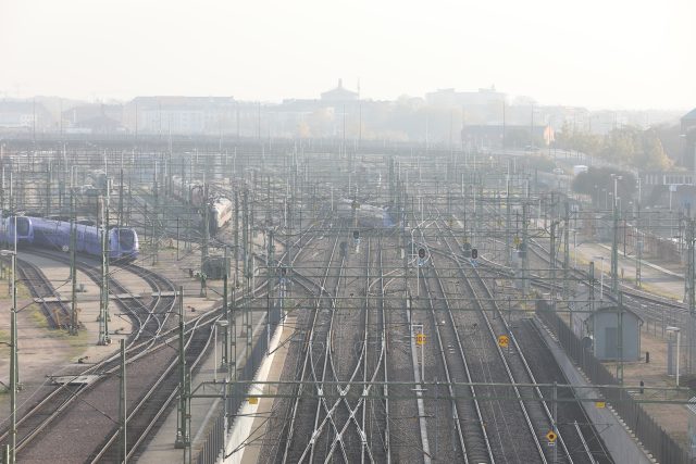 a train tracks with wires and wires