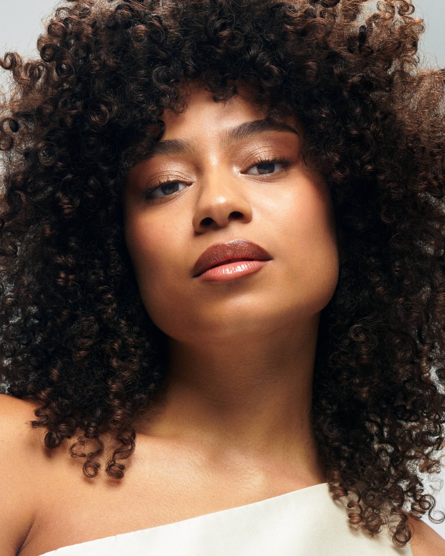 a woman with curly hair