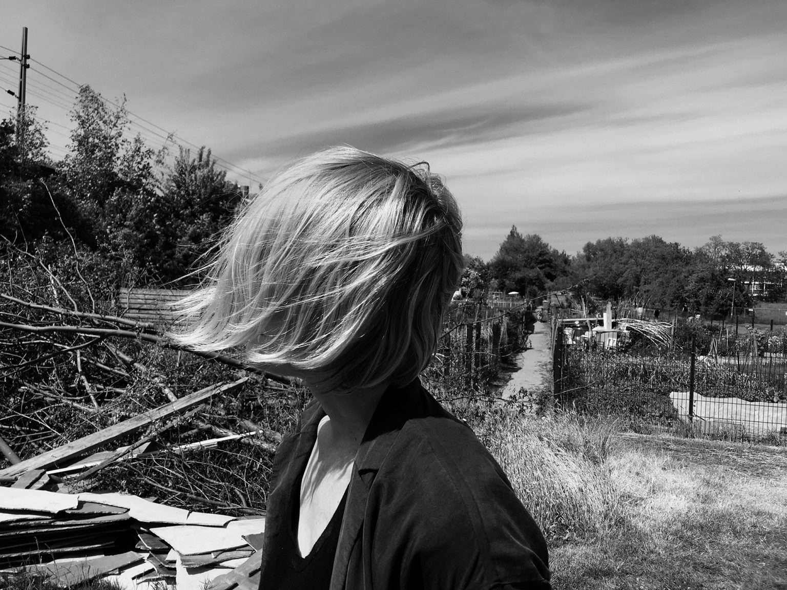 a woman with her hair blowing in the wind