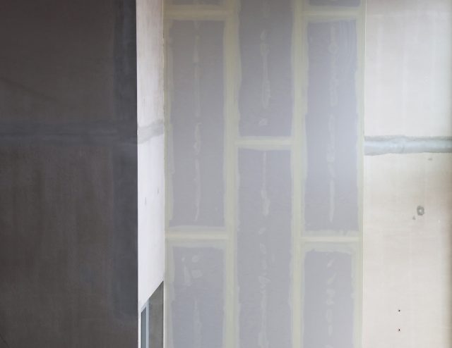 a wall with white paint on it