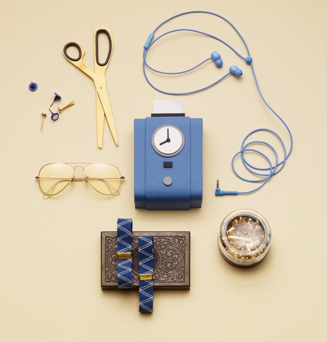 a blue device with a clock and glasses and a watch