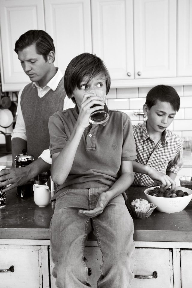 a group of people in a kitchen