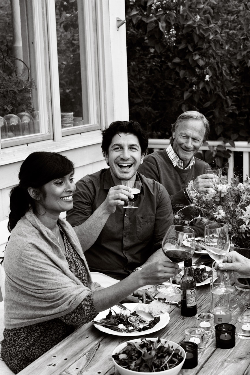a group of people sitting at a table with wine glasses