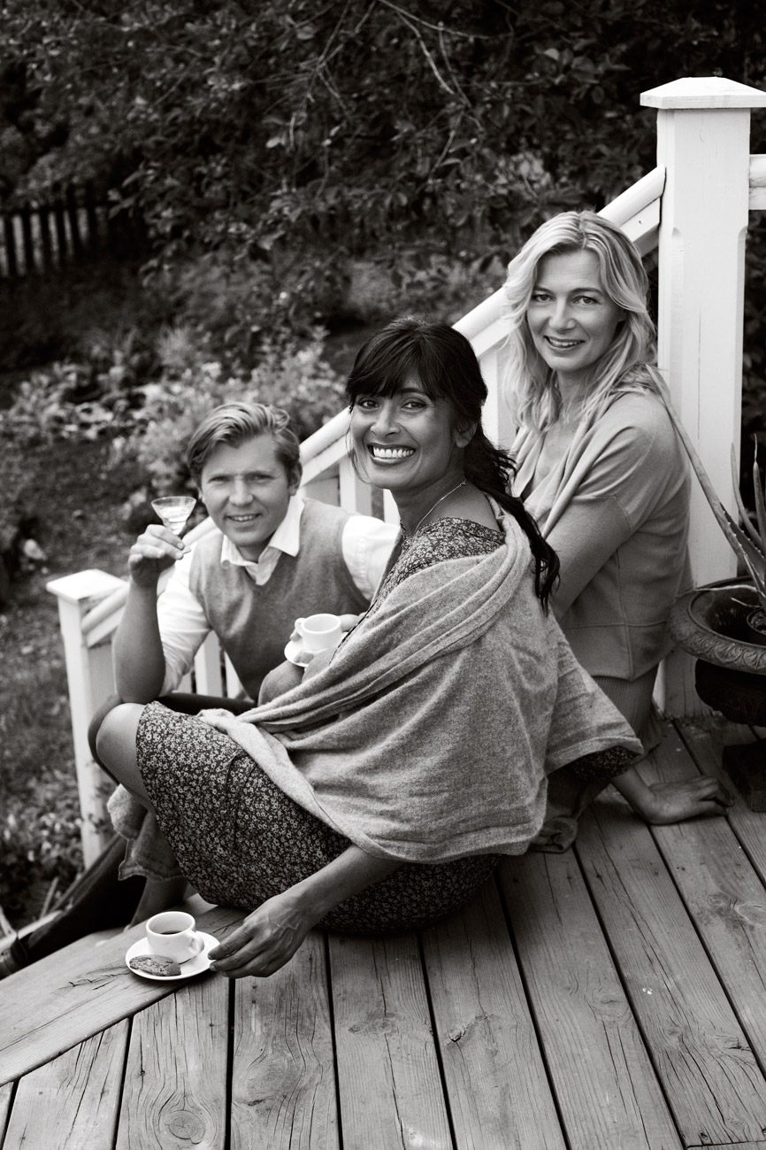 a group of people sitting on a porch