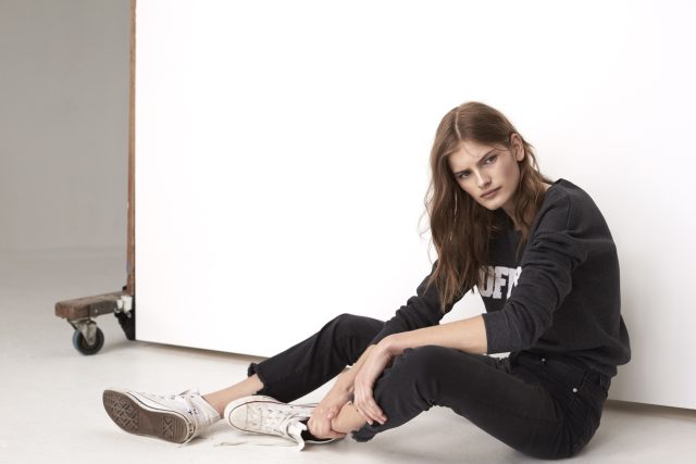 a woman sitting on the floor