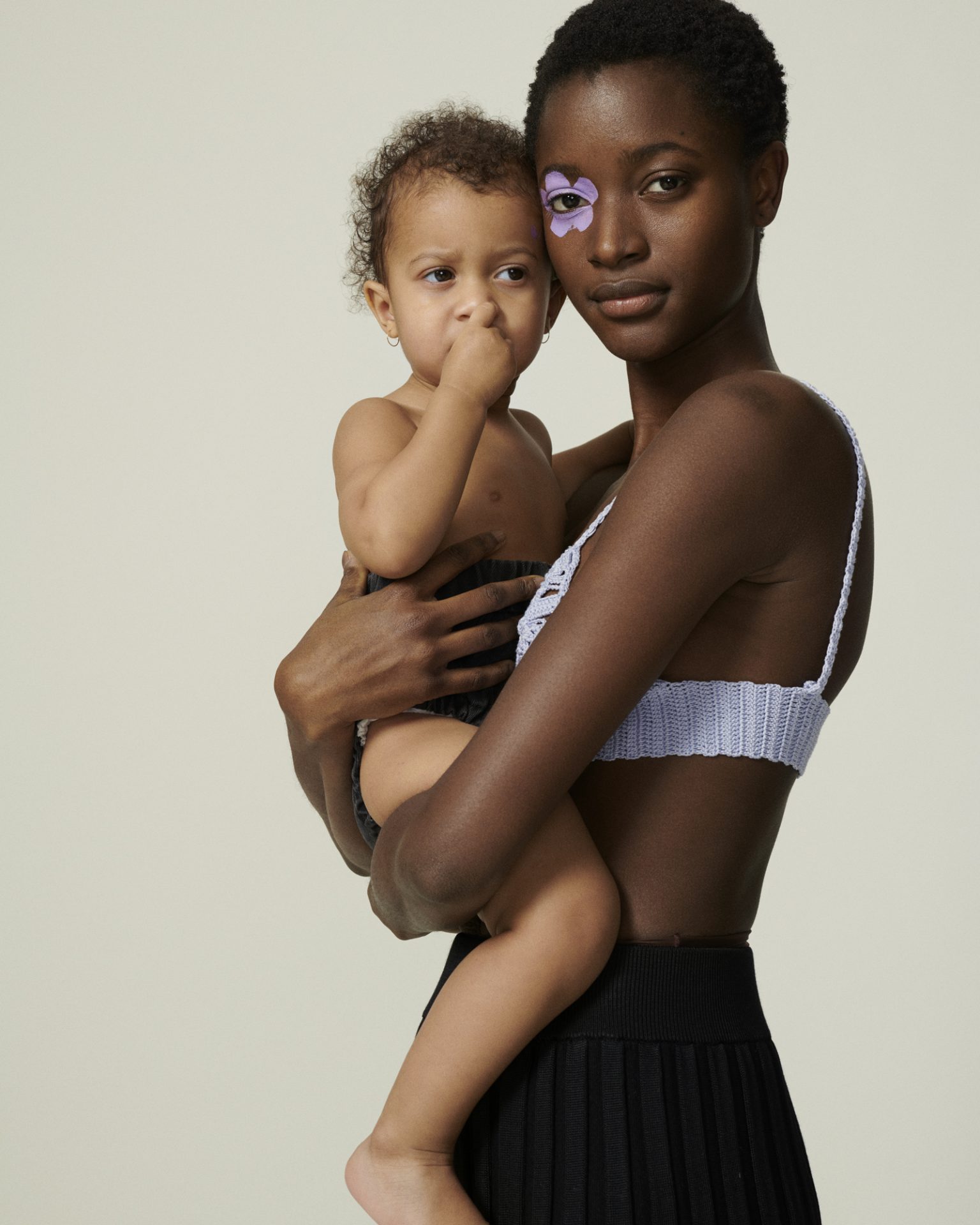 a woman holding a baby