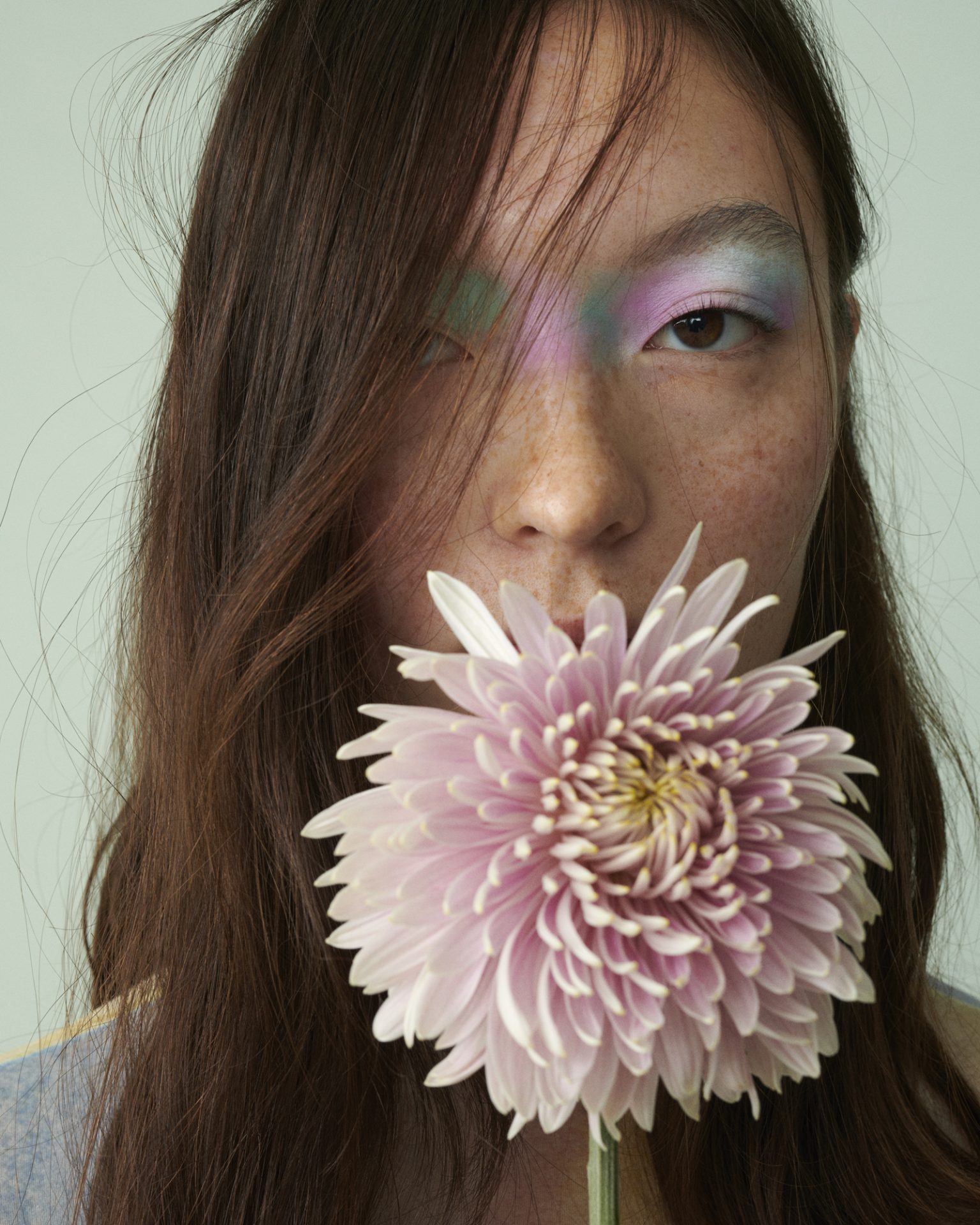 a woman holding a flower