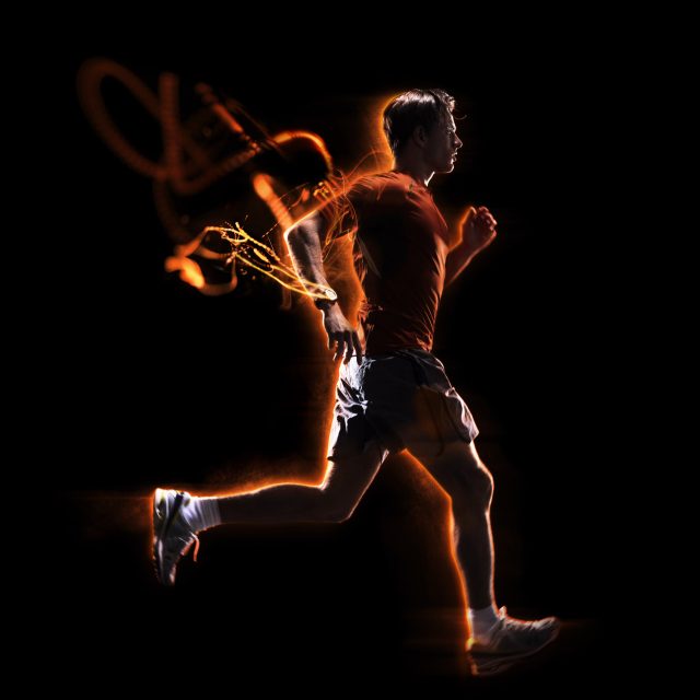 a man running with orange light