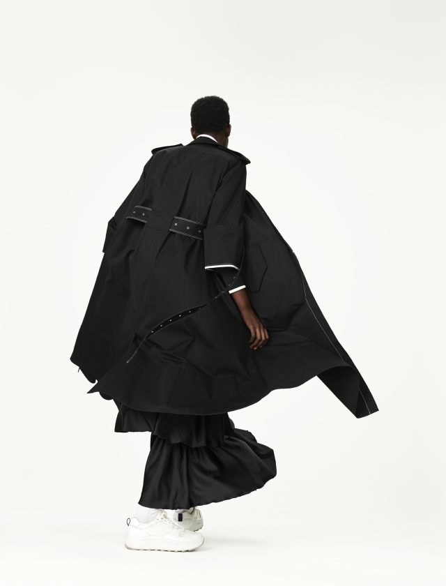 a man in a long black coat