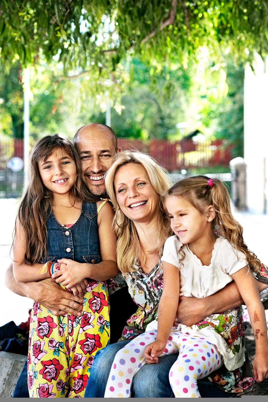 a man and woman with two girls