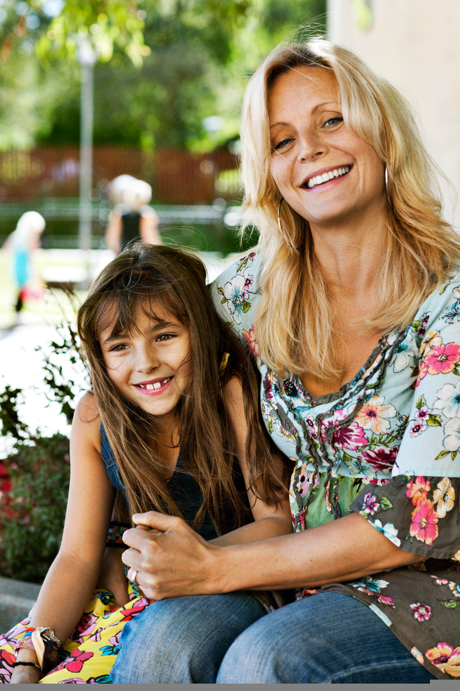 a woman and a girl smiling