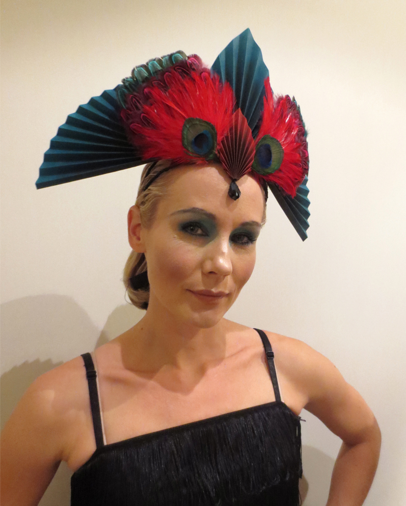a woman wearing a feathered headdress