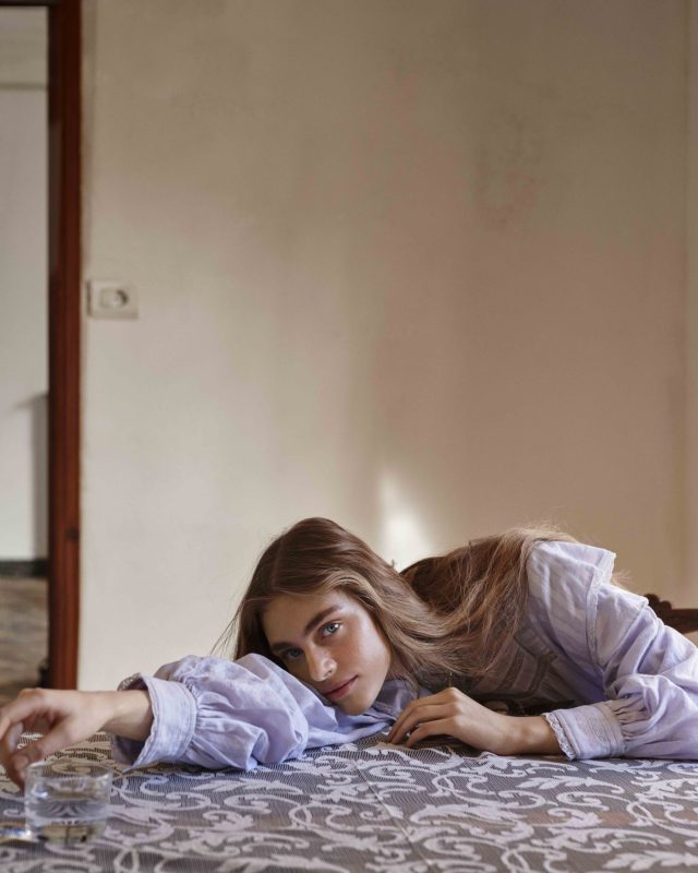 a woman lying on a table