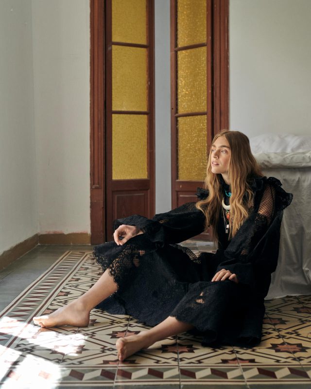 a woman sitting on the floor
