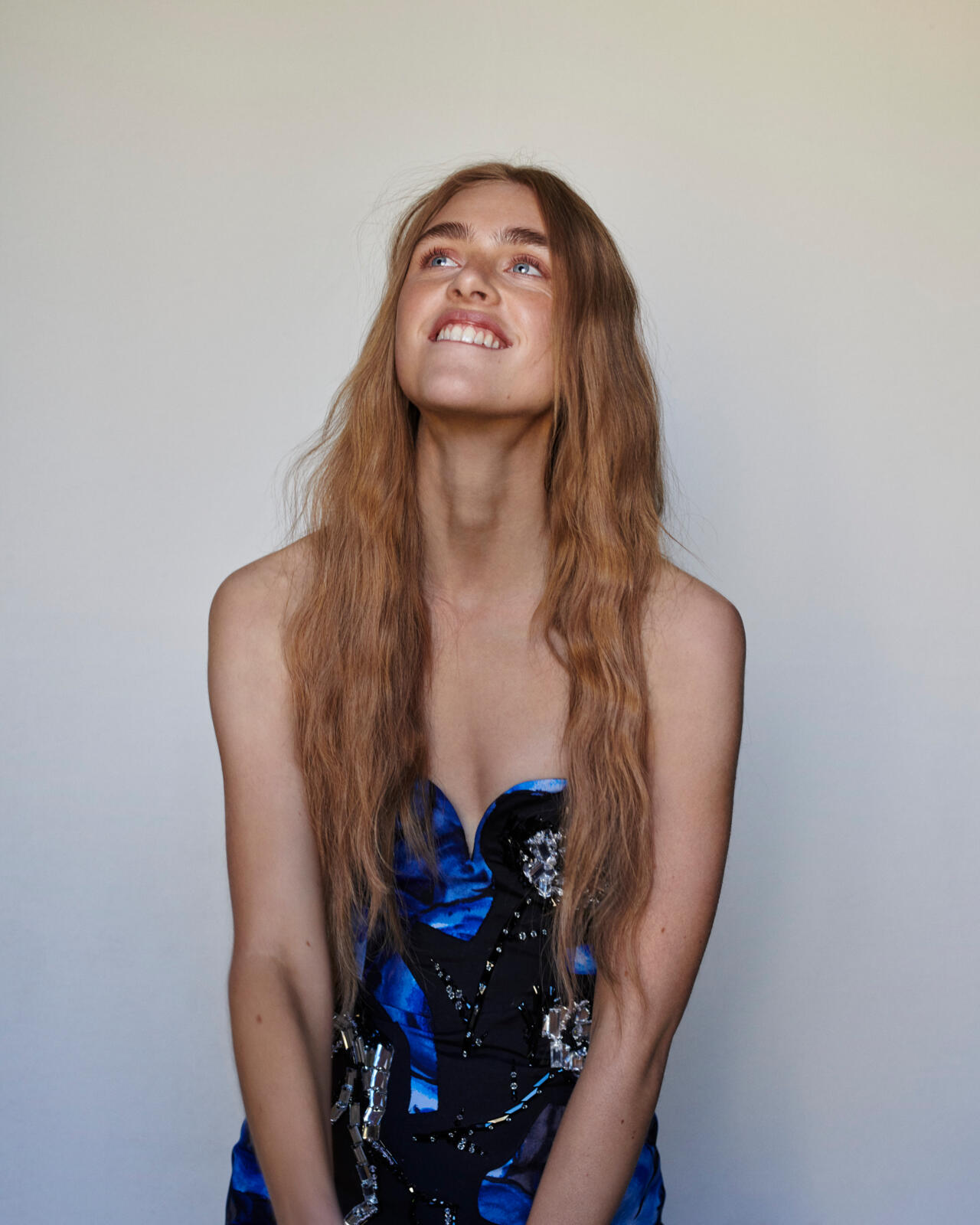 a woman smiling with long hair