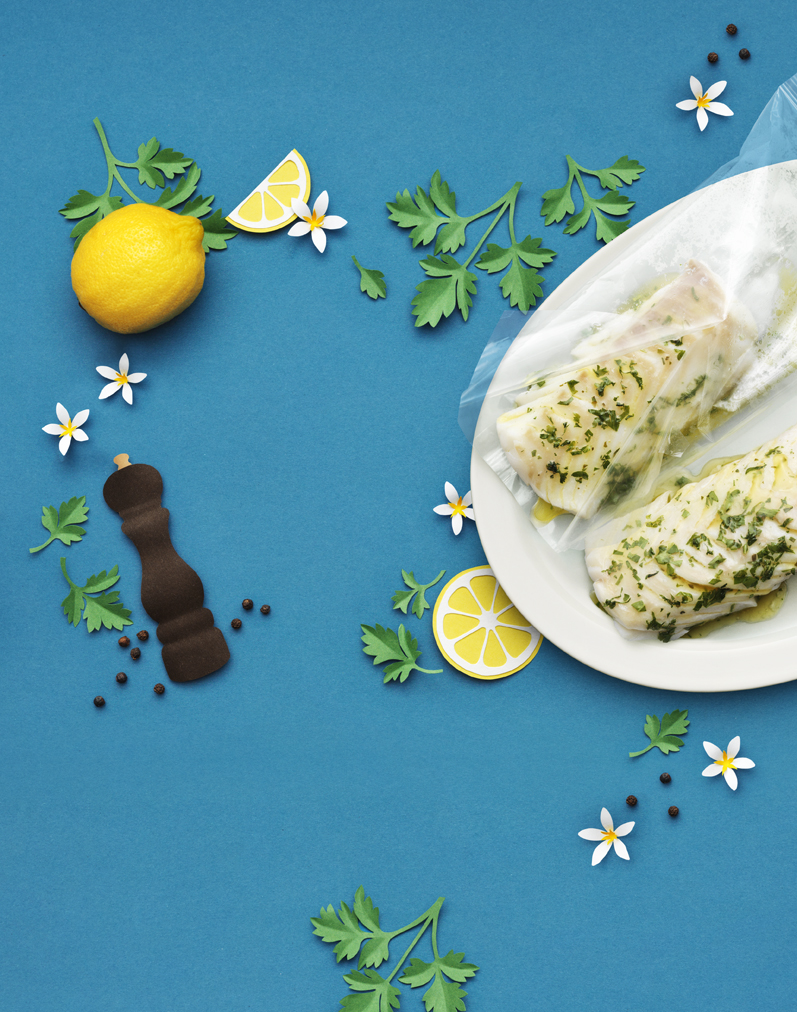 food on a plate with lemons and spices