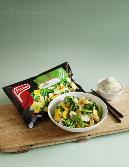 a bowl of food next to a bag of food