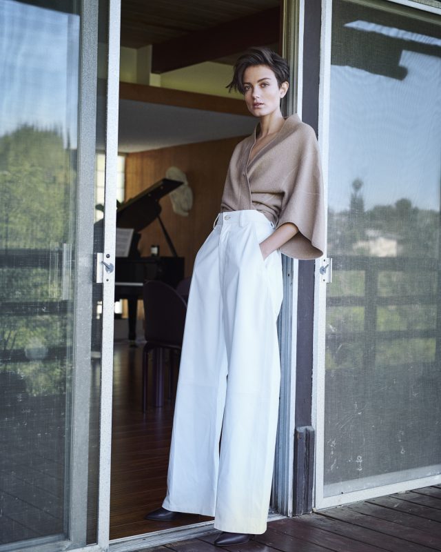 a woman standing in a doorway