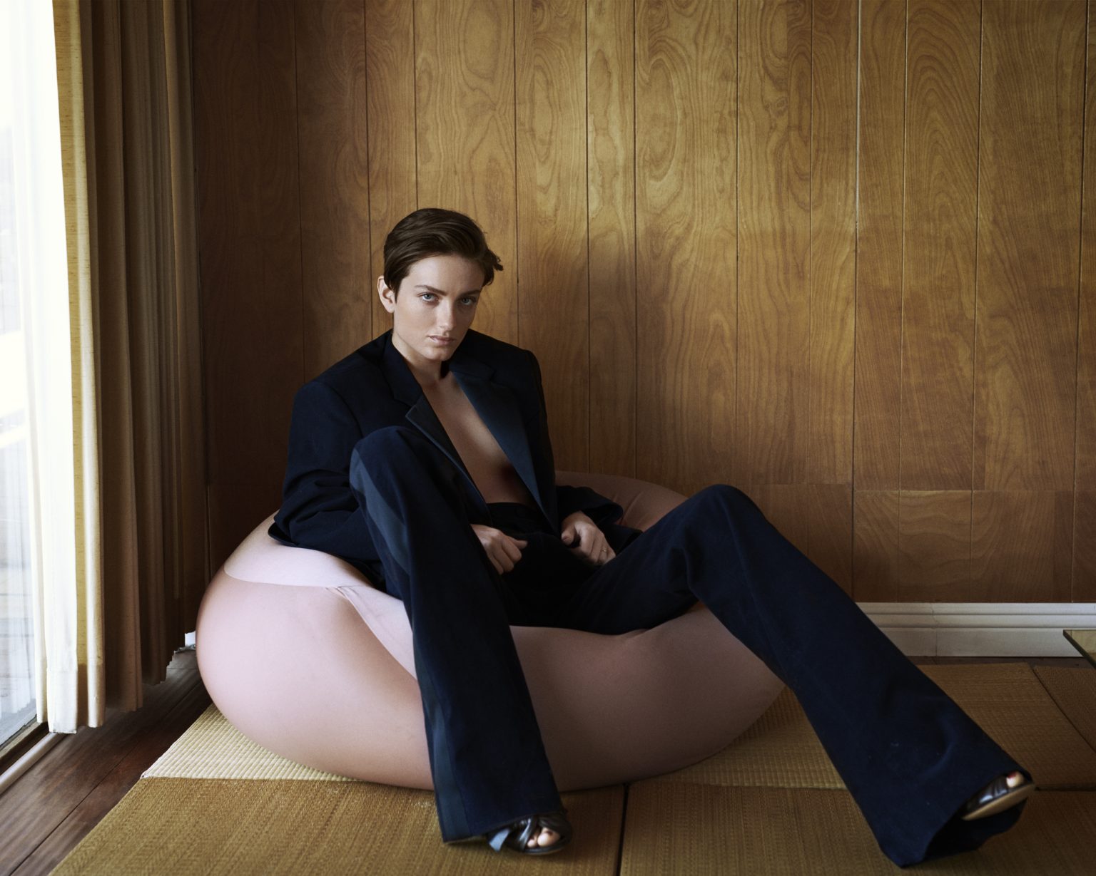 a person sitting on a bean bag