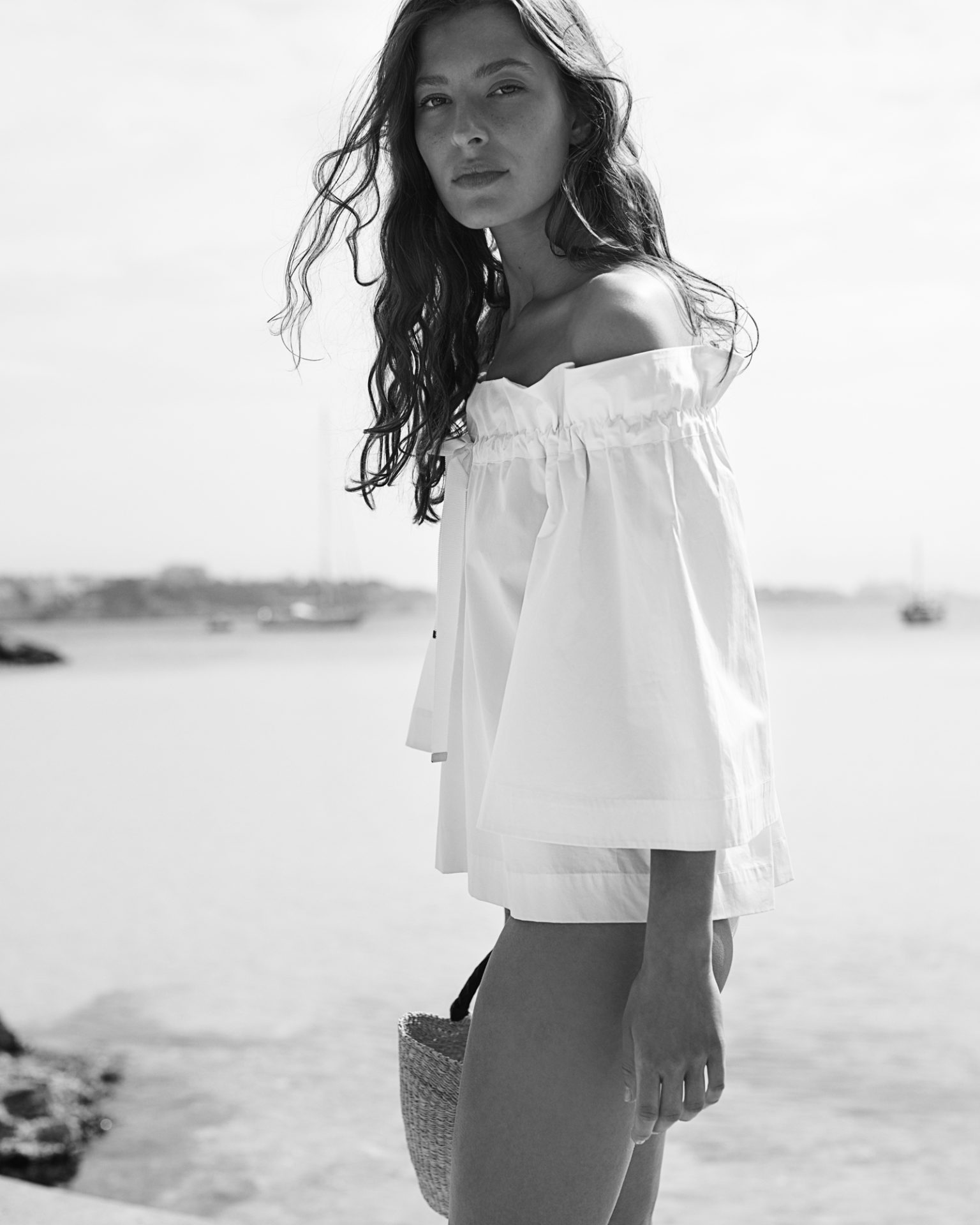 a woman standing on a beach
