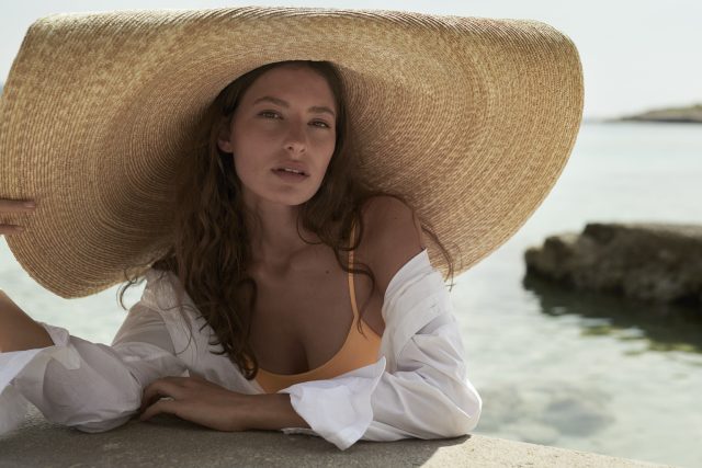 a woman wearing a large hat