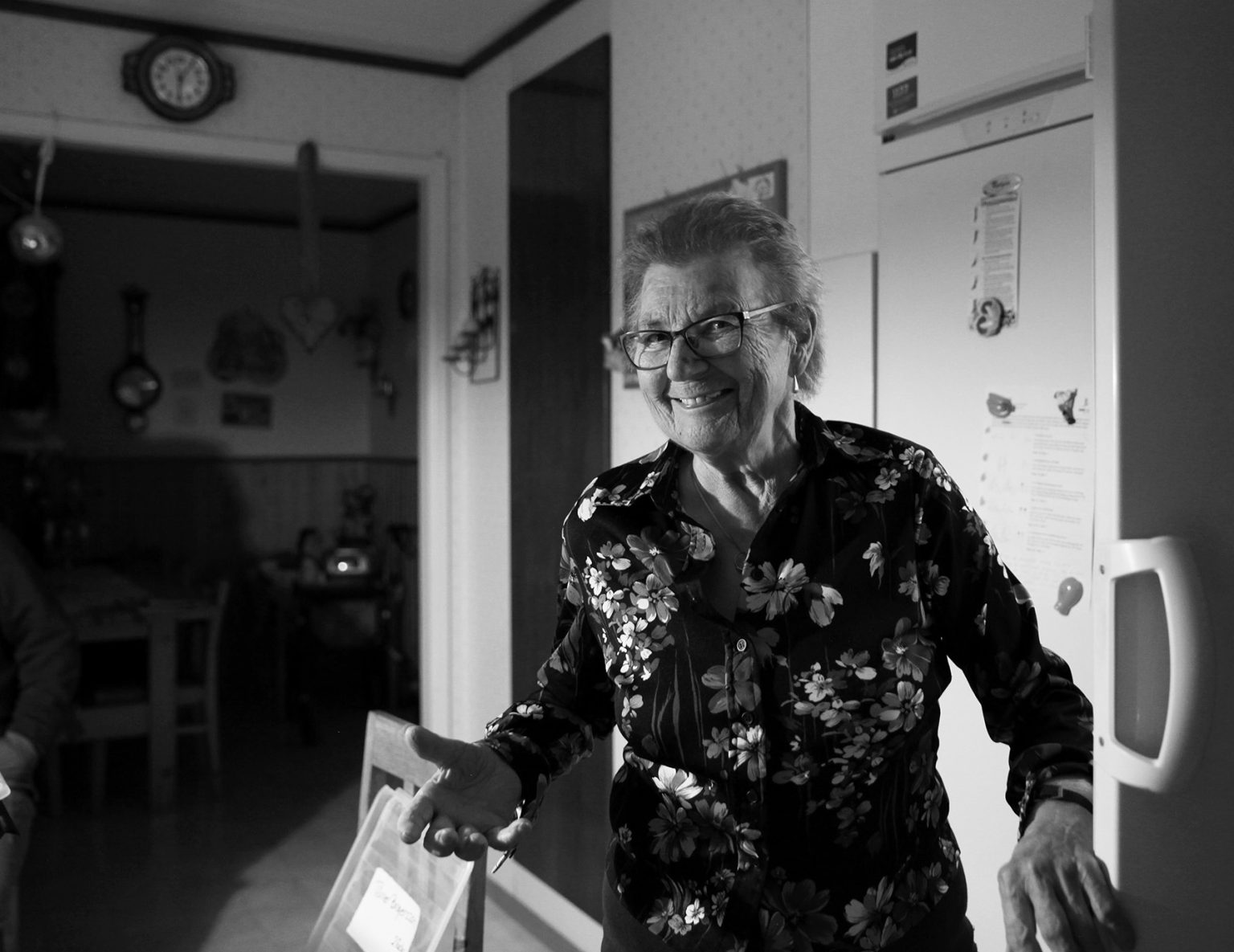 a woman standing in a kitchen