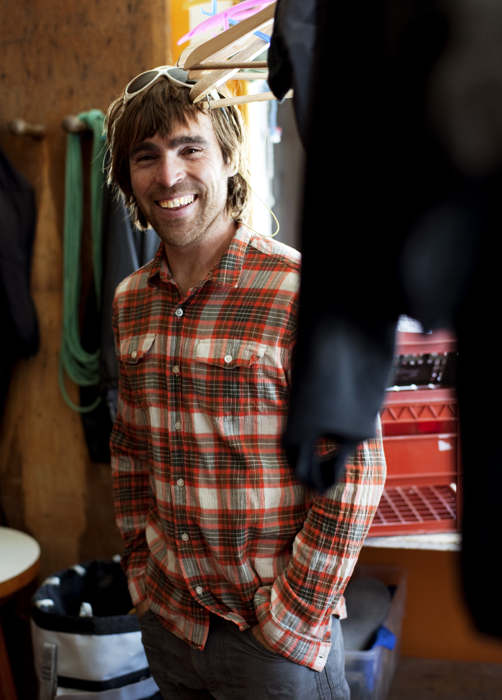 a man smiling with a stick on his head