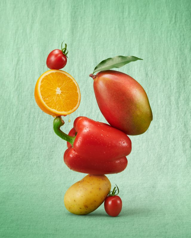 a group of fruits stacked on each other