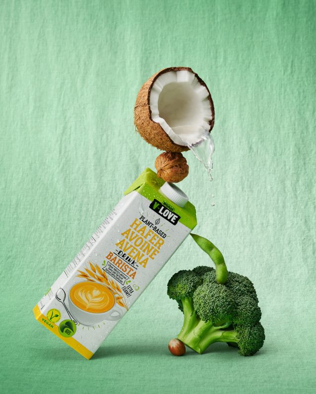 a coconut and broccoli with a carton of milk