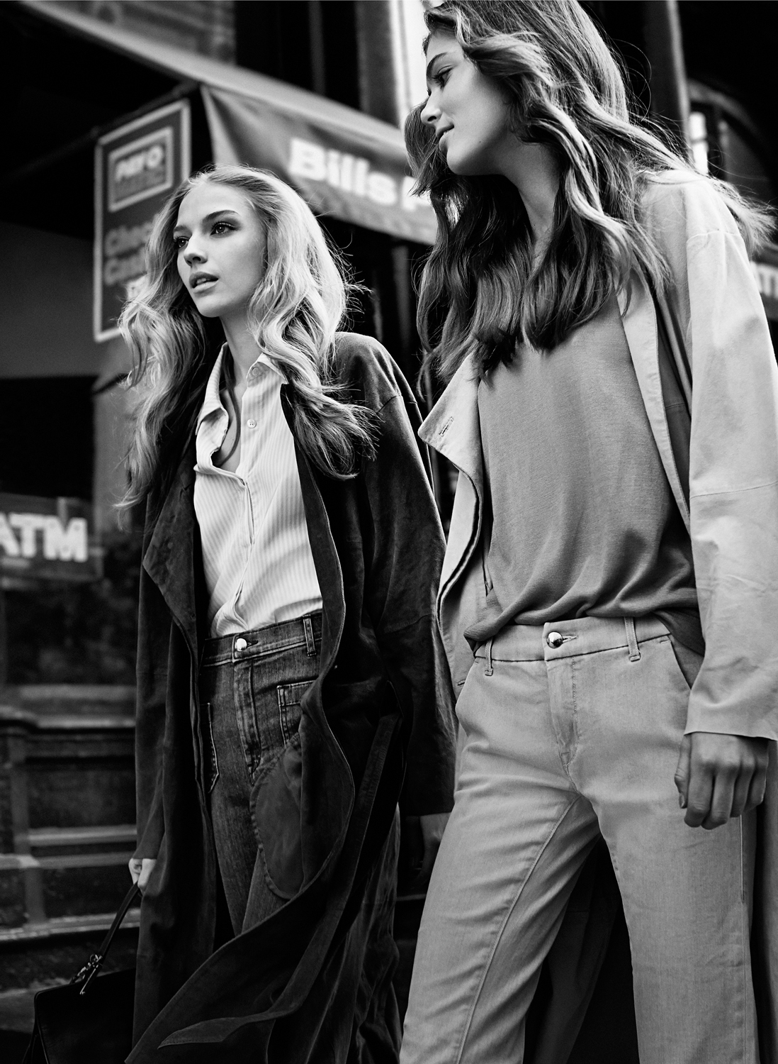 a couple of women walking down the street