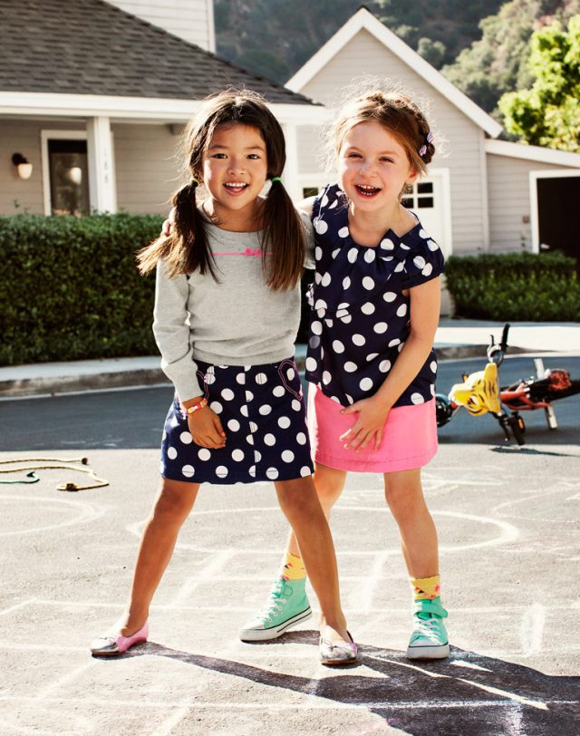 two girls standing next to each other