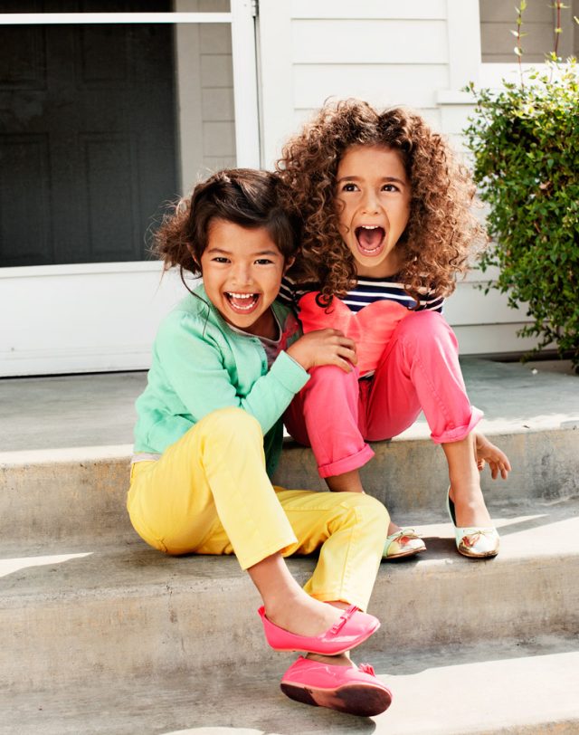 two girls sitting on steps