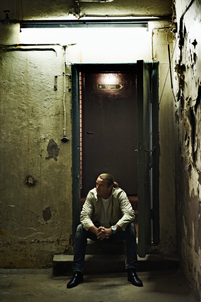 a man sitting in a doorway
