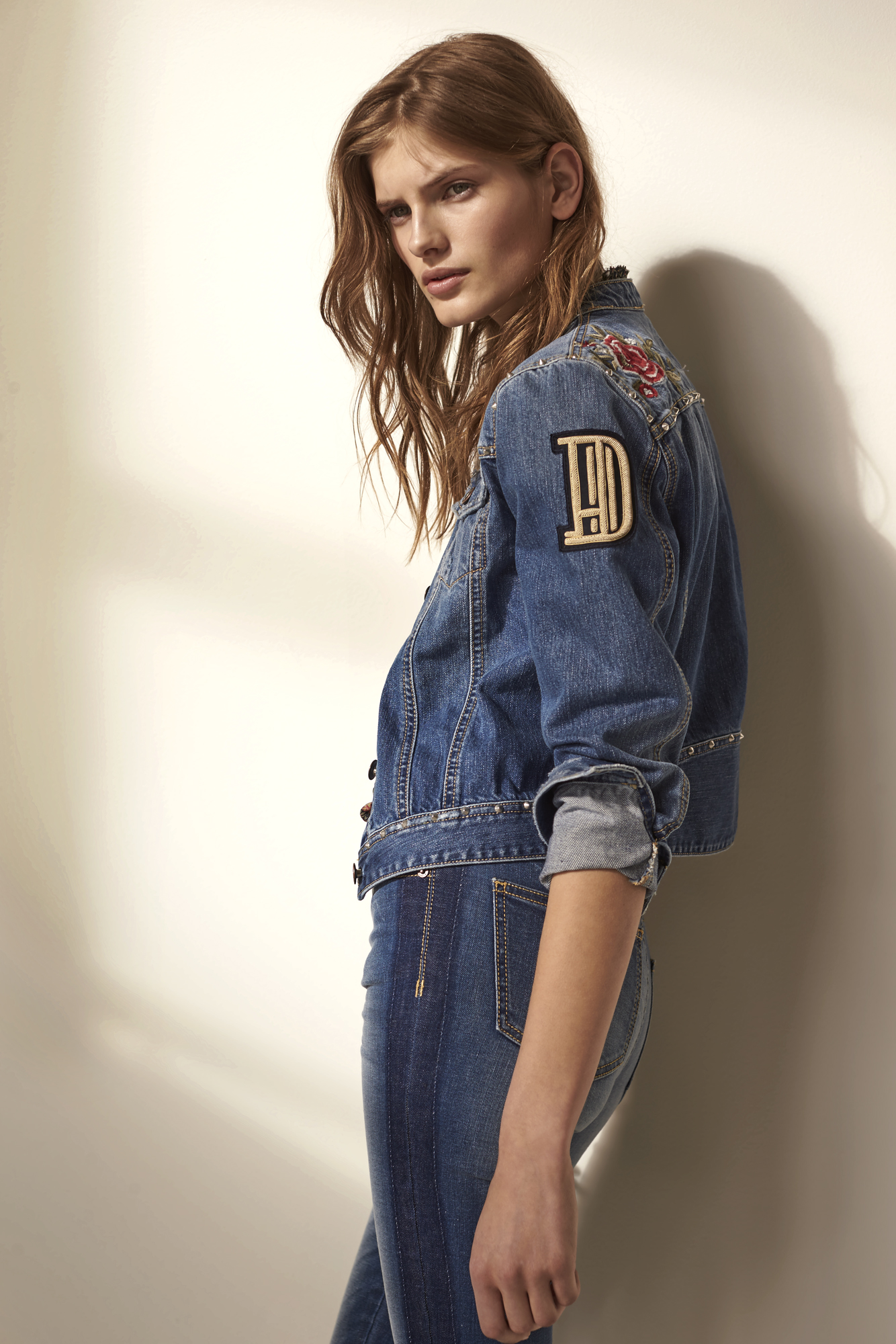 a woman in a denim jacket