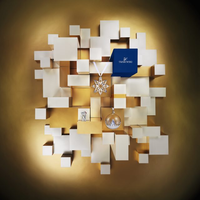 a group of white boxes with gold and silver objects