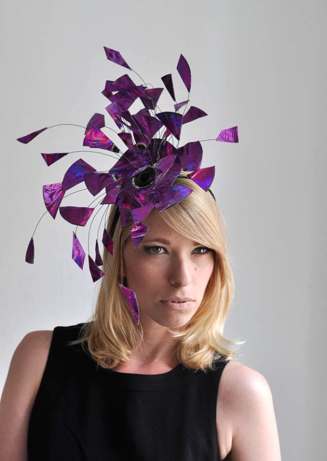 a woman wearing a purple hat