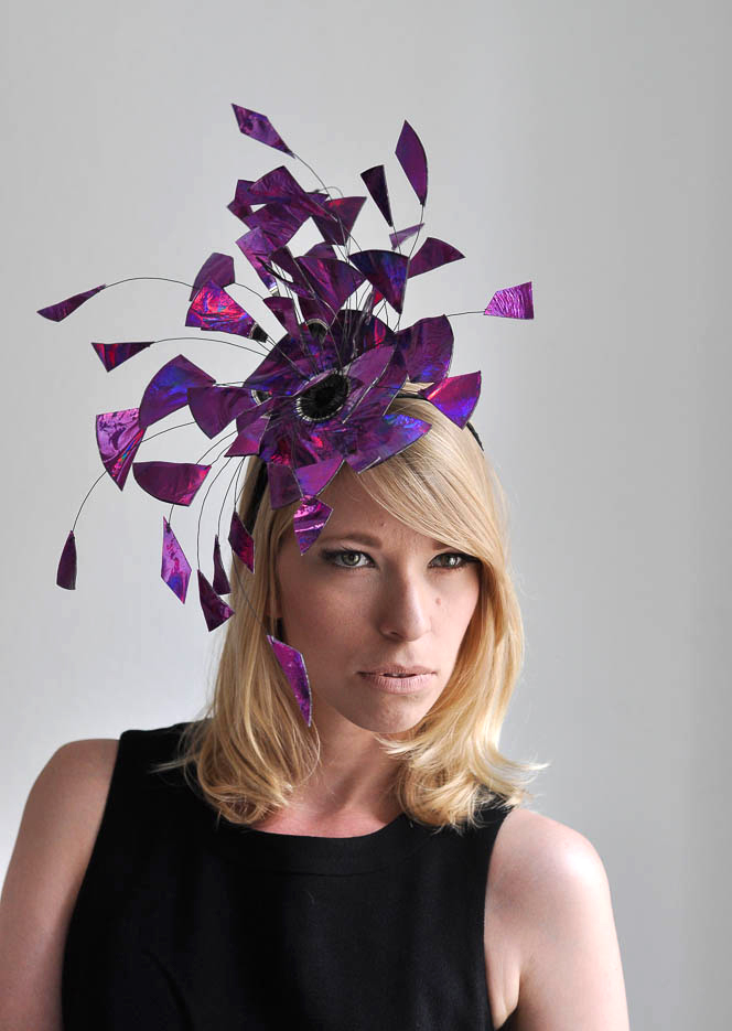 a woman wearing a purple hat