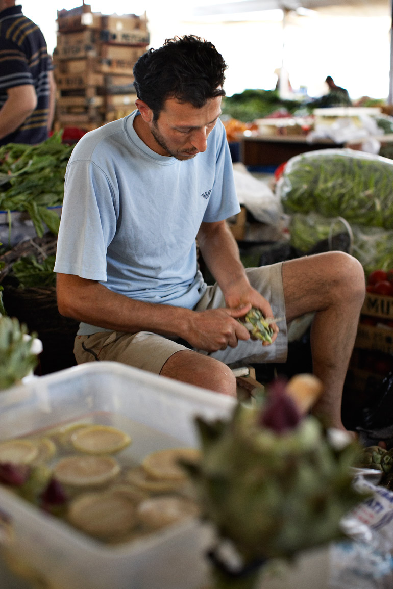 a man sitting at a market