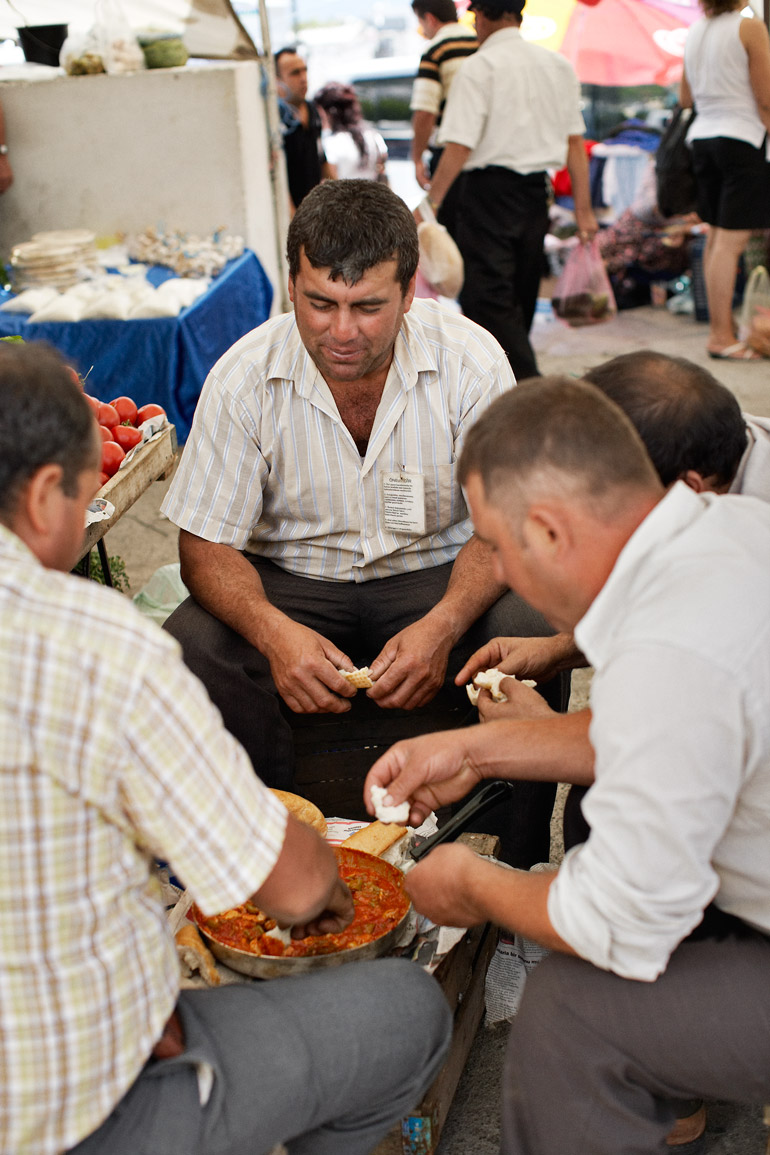 a group of men at a market