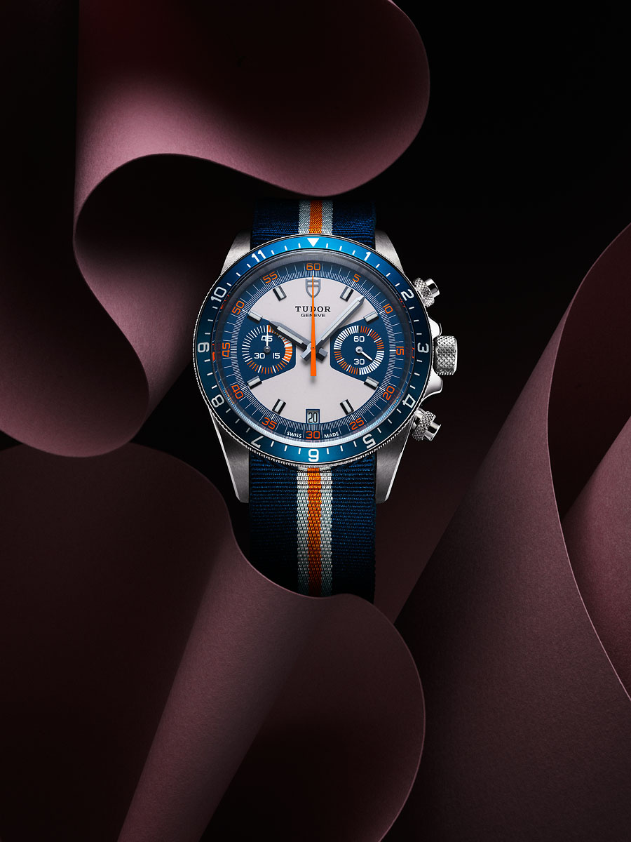 a watch on a purple background